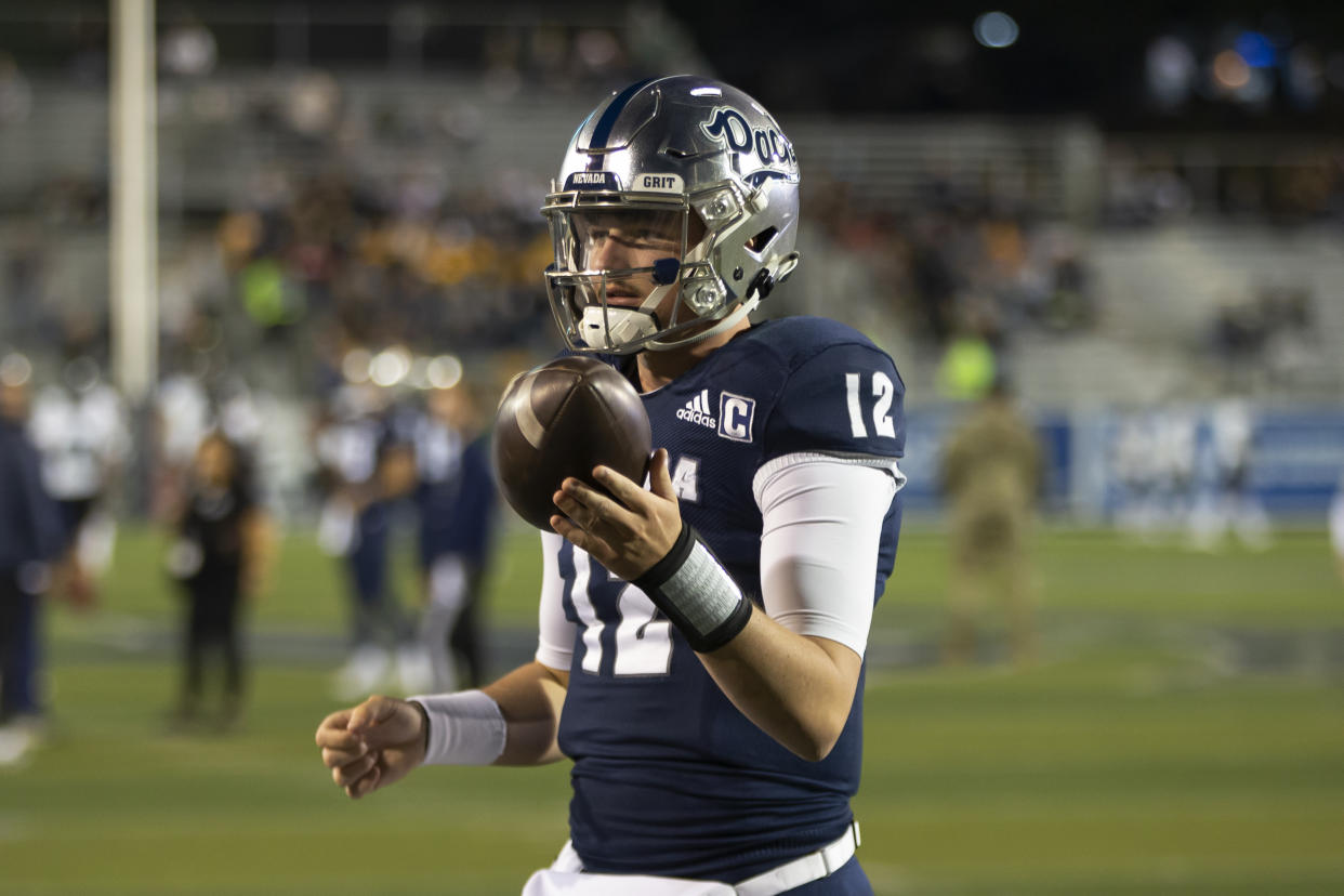 Nevada quarterback Carson Strong (12) warms up before an NCAA college football game against Hawaii in Reno, Nev., Saturday, Oct. 16, 2021. (AP Photo/Tom R. Smedes)