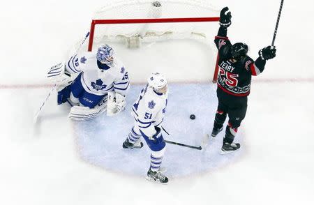 Carolina Hurricanes forward Chris Terry (25) celebrates his 1st period goal past the Toronto Maple Leafs goalie Jonathan Bernier (45) at PNC Arena. The Carolina Hurricanes defeated the Toronto Maple Leafs 4-1. Mandatory Credit: James Guillory-USA TODAY Sports