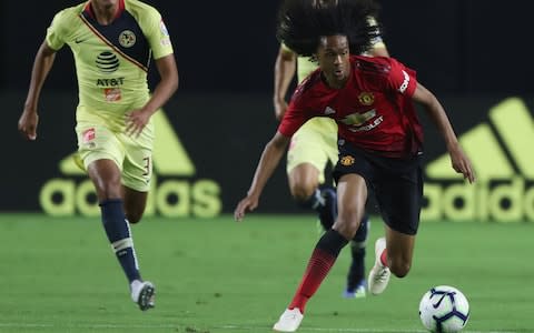 Dutch wing Tahith Chong runs with the ball - Credit: getty images