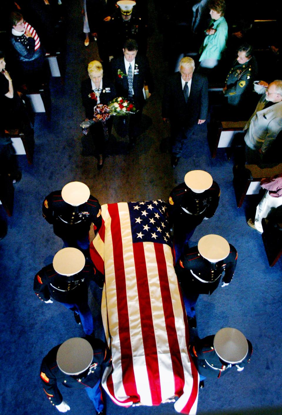 A Marine honor guard removes the casket containing the body of Cpl. Patrick Nixon after services at the College Heights Baptist Church in Gallatin, Tenn., April 15, 2003. Nixon, the first Tennesseean to die in combat during the Iraq war.