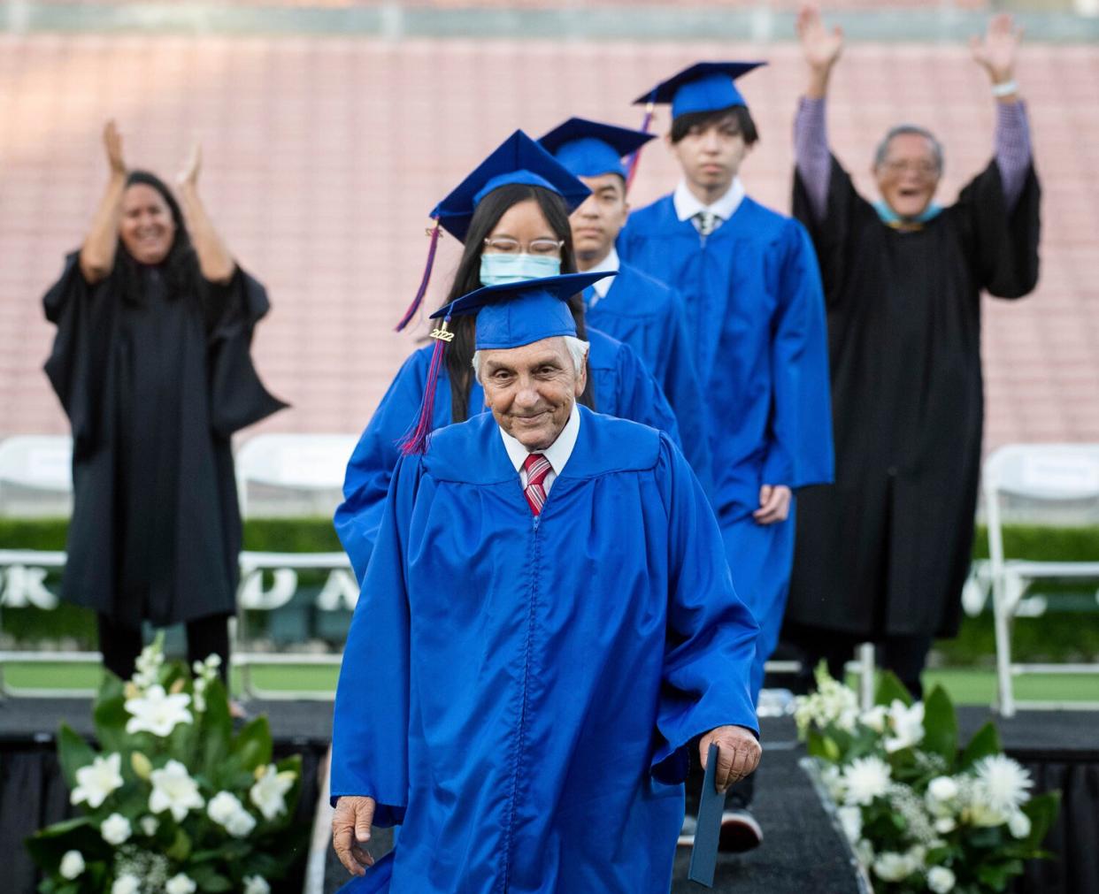 Ted Sams, 78, receives his original high school diploma during San Gabriel High School's graduation at the Rose Bowl on Friday, May 27, 2022, in Pasadena, Calif.