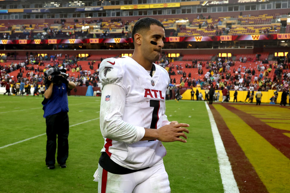 LANDOVER, MARYLAND - NOVEMBER 27: Marcus Mariota #1 of the Atlanta Falcons walks off the field after losing to the Washington Commanders 19-13 at FedExField on November 27, 2022 in Landover, Maryland.  (Photo by Rob Carr/Getty Images)