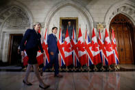 Britain's Prime Minister Theresa May (L) and Canada's Prime Minister Justin Trudeau arrive at news conference on Parliament Hill in Ottawa, Ontario, Canada, September 18, 2017. REUTERS/Chris Wattie