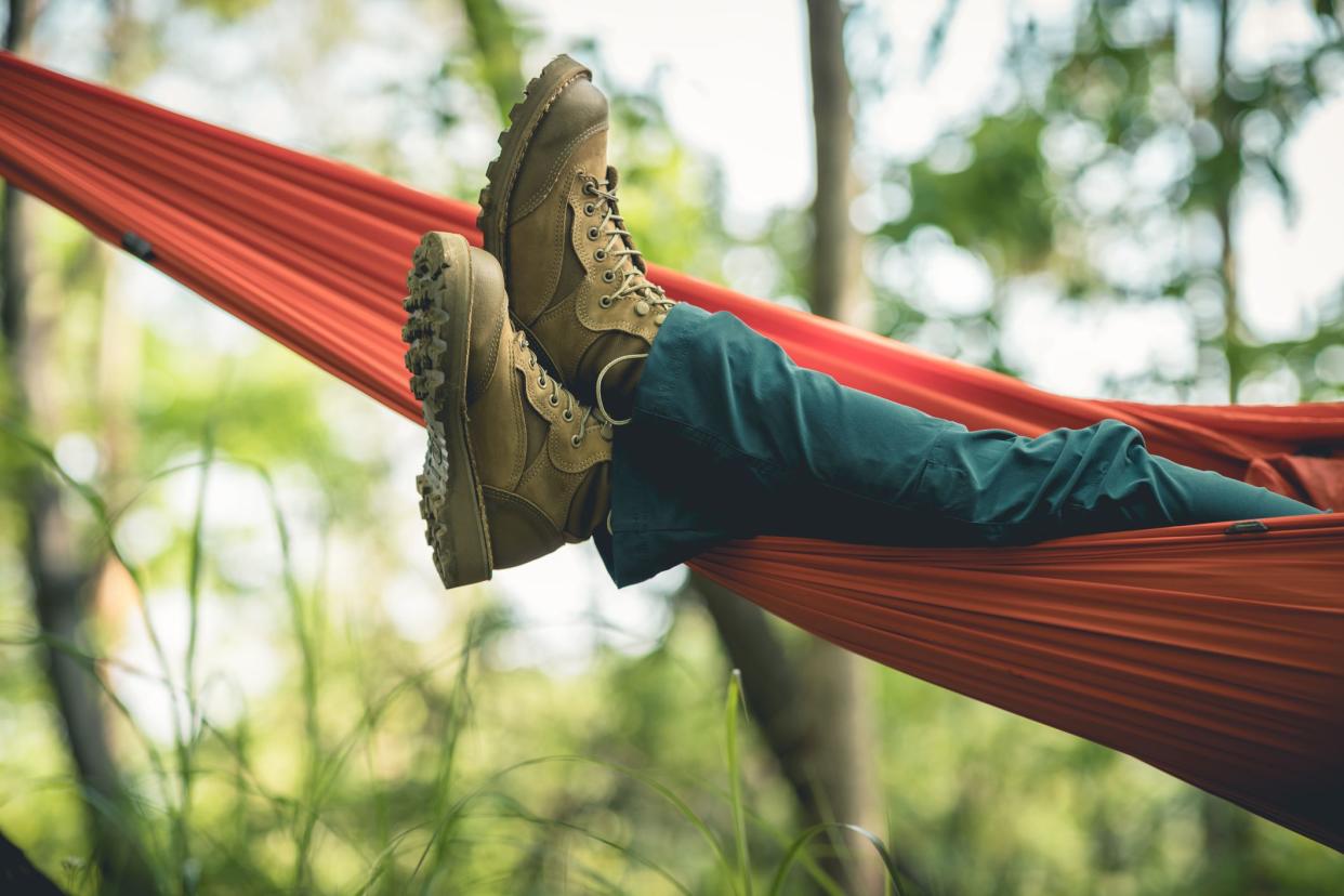 Relaxing in hammock in tropical forest