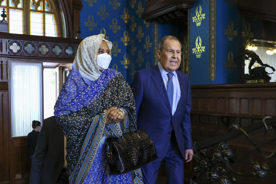 FILE - In this photo released by the Russian Foreign Ministry Press Service, Russian Foreign Minister Sergey Lavrov, and Sudanese Foreign Minister Maryam al-Sadiq al-Mahdi arrive to attend talks in Moscow, on July 12, 2021. (Russian Foreign Ministry Press Service via AP, File)