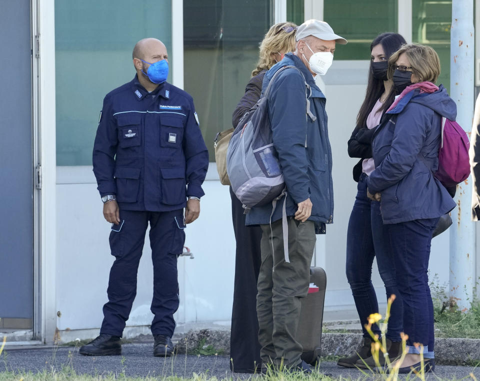 FILE - In this Thursday, Oct. 14, 2021 file photo, the family of slain Italian doctoral student Giulio Regeni, from right, mother Paola Regeni, Giulio's sister Irene, and father Claudio arrive with their lawyer Alessandra Ballerini, fourth from right, at the Rebibbia prison in Rome to attend the first hearing of the trial for the death of Italian doctoral student Giulio Regeni in January 2016 in Egypt. The trial was halted on the day it opened because there was no certainty that the defendants had been officially informed that they were charged. A new trial starts in Rome on Tuesday, Feb. 20, 2024, after Italy's Constitutional Court changed the law. (AP Photo/Andrew Medichini)