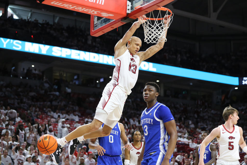 Mar 4, 2023; Fayetteville, Arkansas, USA; Arkansas Razorbacks guard Jordan Walsh (13) dunks the ball in the second half as <a class="link " href="https://sports.yahoo.com/ncaab/teams/kentucky/" data-i13n="sec:content-canvas;subsec:anchor_text;elm:context_link" data-ylk="slk:Kentucky Wildcats;sec:content-canvas;subsec:anchor_text;elm:context_link;itc:0">Kentucky Wildcats</a> forward Jacob Toppin (0) and guard Adou Thiero (3) look on at Bud Walton Arena. Kentucky won 88-79. Mandatory Credit: Nelson Chenault-USA TODAY Sports