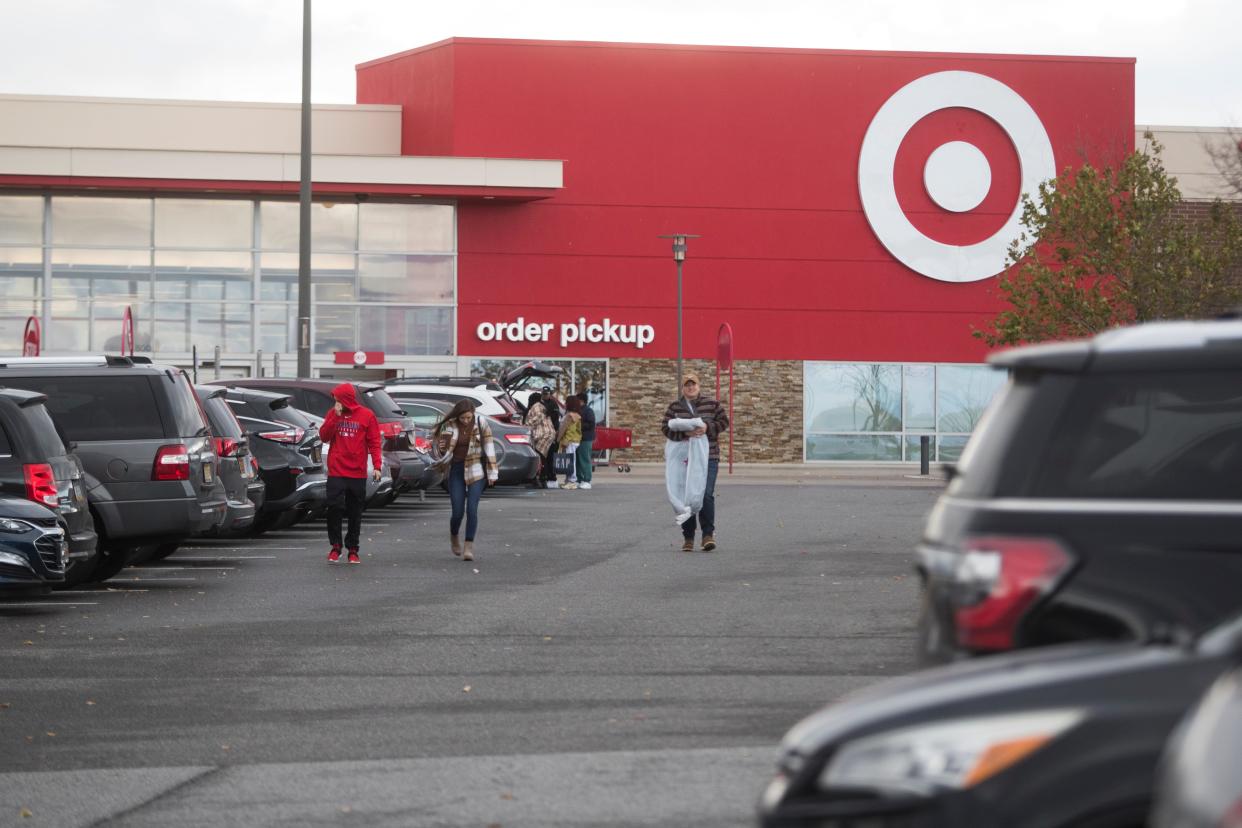 Black Friday shoppers leave Target at Christiana Mall Friday, Nov. 26, 2021.  