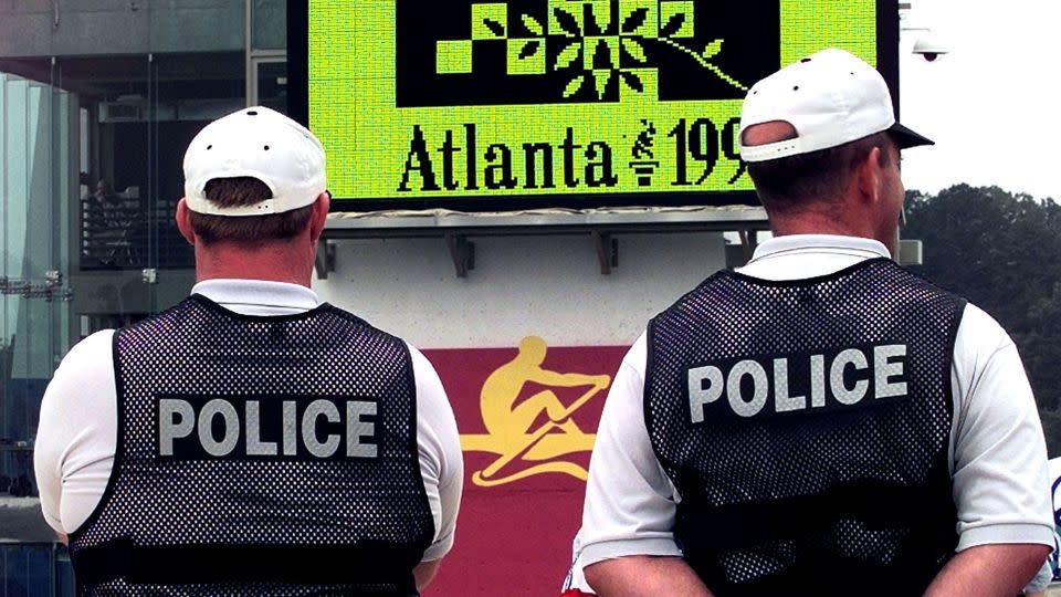 Police officers stand guard at the rowing and kayak competitions venue at Lake Lanier near Gainesville, Georgia, ahead of the 1996 Olympic Games. - Charles Platiau/Reuters