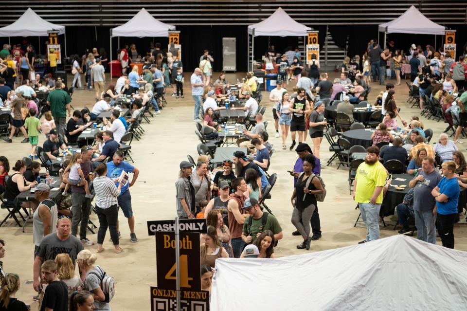 Tables and tents set up during The Big Cheese mac and cheese festival at Kellogg Arena in Battle Creek on Saturday, April 15, 2023.