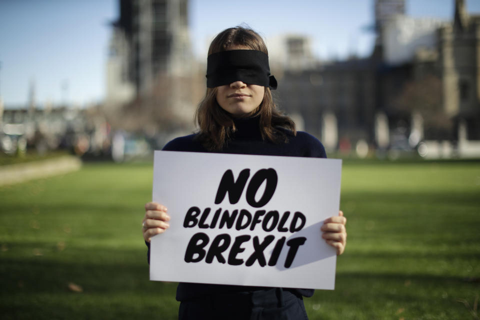 Lara Spirit, aged 22 from Chichester, a remain in the European Union supporter and member of the "Our Future, Our Choice" (OFOC) young people against Brexit organisation campaigning for a People's Vote second referendum on Britain's EU membership, poses for photographs after taking part in a protest against a blindfold Brexit on Parliament Square opposite the Houses of Parliament in London, Thursday, Feb. 14, 2019. Lara believes a People's Vote second referendum would be the best way forward. Britain voted to leave Europe in a referendum more than two years ago, but Parliament has been unable to agree on a withdrawal arrangement, prompting some calls for a delay or even a cancellation of the split. (AP Photo/Matt Dunham)