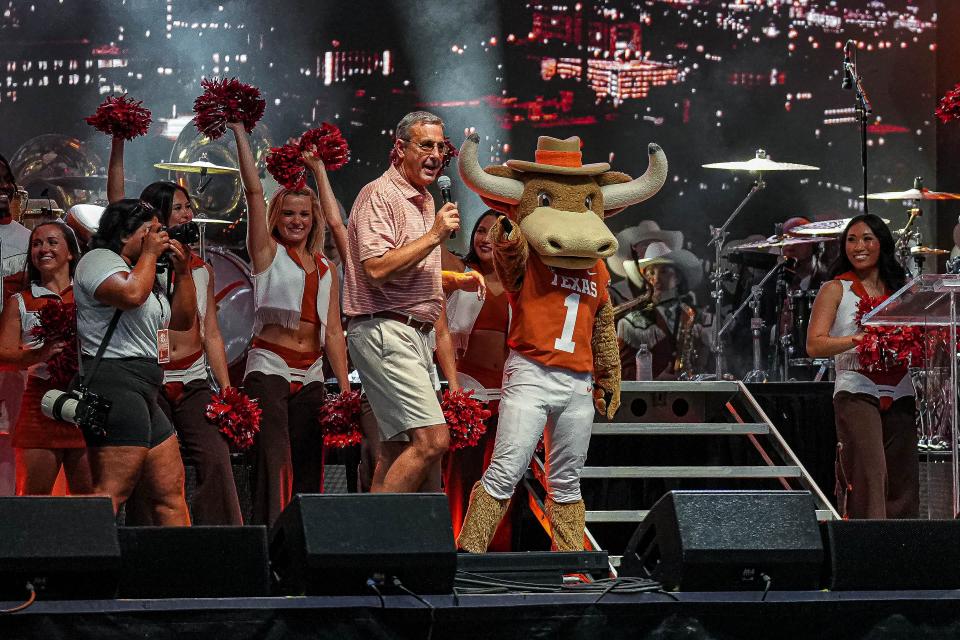 Texas athletic director parties with Hook 'Em at Sunday's SEC Celebration on the South Mall on campus. SEC commissioner Greg Sankey officially welcomed Texas into the league. The Horns and Oklahoma officially joined Monday.