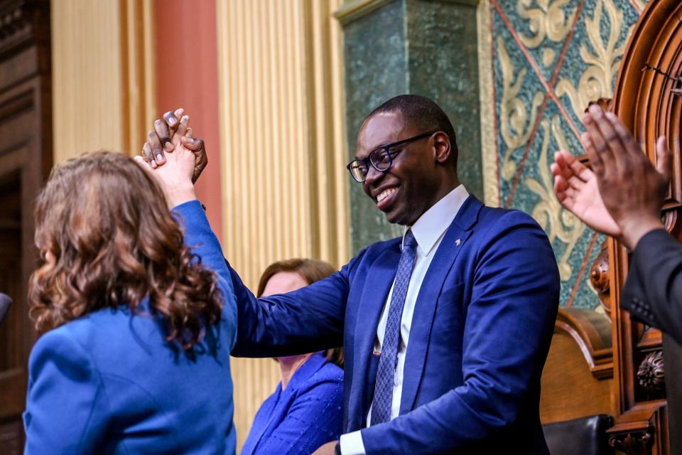 Gov. Gretchen Whitmer, left, shakes hands with Lt. Gov. Garlin Gilchrist during her State of the State address on Wednesday, Jan. 25, 2023, at the Michigan State Capitol in Lansing. 