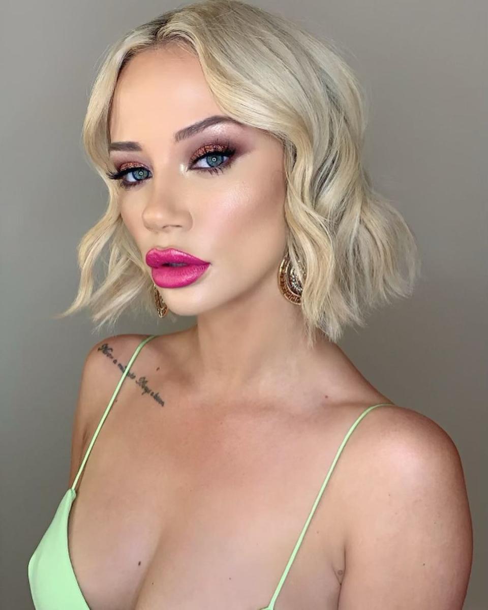 Jessika Power in a green top and pink lipstick