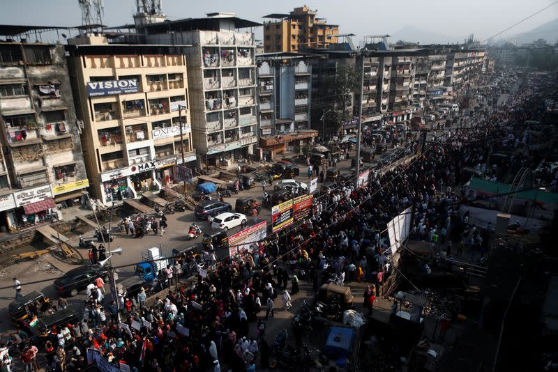 Demonstrators march on a street during a protest against a new citizenship law on the outskirts of Mumbai