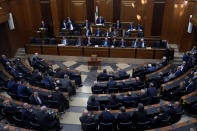 Lebanese lawmakers gather to elect a president at the parliament building in downtown Beirut, Lebanon, Thursday, Sept. 29, 2022. Lebanon's Parliament on Thursday failed to elect a new president with the majority of lawmakers casting blank ballots. (AP Photo/Bilal Hussein)