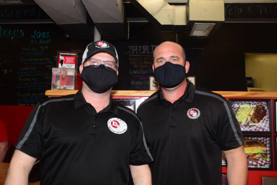Owners Bruce Flomberg and Daniel Price wear their masks to welcome customers to D & B Hot Dogs, home of the “Best Hot Dog in Tennessee.” Monday, March 1, 2021. “We adhere to all the pandemic protocols to keep our customers safe,” said Flomberg.