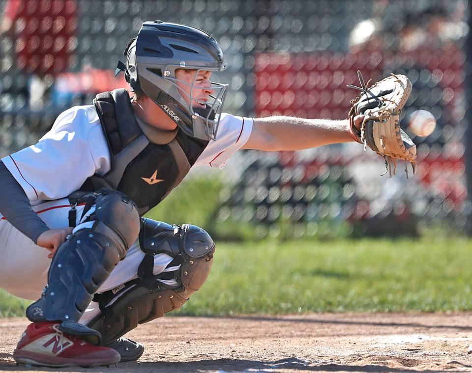 Hingham High senior baseball catcher Ben Cashman in action against Marshfield on Wednesday, May 18, 2022.