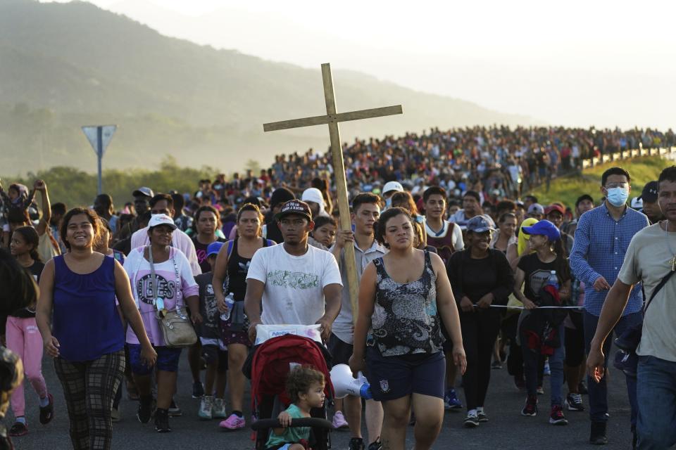 Migrants leave Huixtla, Chiapas state, Mexico, Oct. 27, 2021, as they continue their trek north toward Mexico's northern states and the U.S. border. The Biden administration struck agreement with Mexico to reinstate a Trump-era border policy next week that forces asylum-seekers to wait in Mexico for hearings in U.S. immigration court, U.S. officials said Thursday.