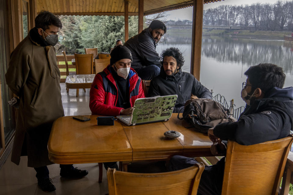Kashmiri Journalists prepare for a meeting to discuss the shutting of Kashmir Press Club building, the region’s only independent press club, in Srinagar, Indian controlled Kashmir, Thursday, Jan. 20, 2022. Local Kashmiri reporters were often the only eyes on the ground for the global audiences, particularly after New Delhi barred foreign journalists from the region without official approval a few years ago. Most of the coverage has focused on the Kashmir conflict and government crackdowns. Authorities are now seeking to control any narrative seen opposite to the broad consensus in India that the region is an integral part of the country. (AP Photo/Dar Yasin)