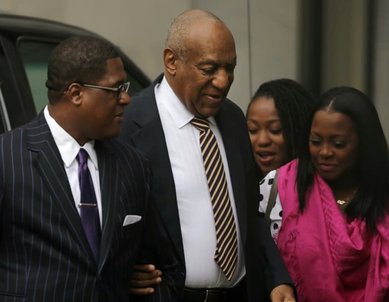 Bill Cosby arrives with Keshia Knight Pulliam (R), who played his daughter Rudy Huxtable on "The Cosby Show" at the Montgomery County Courthouse