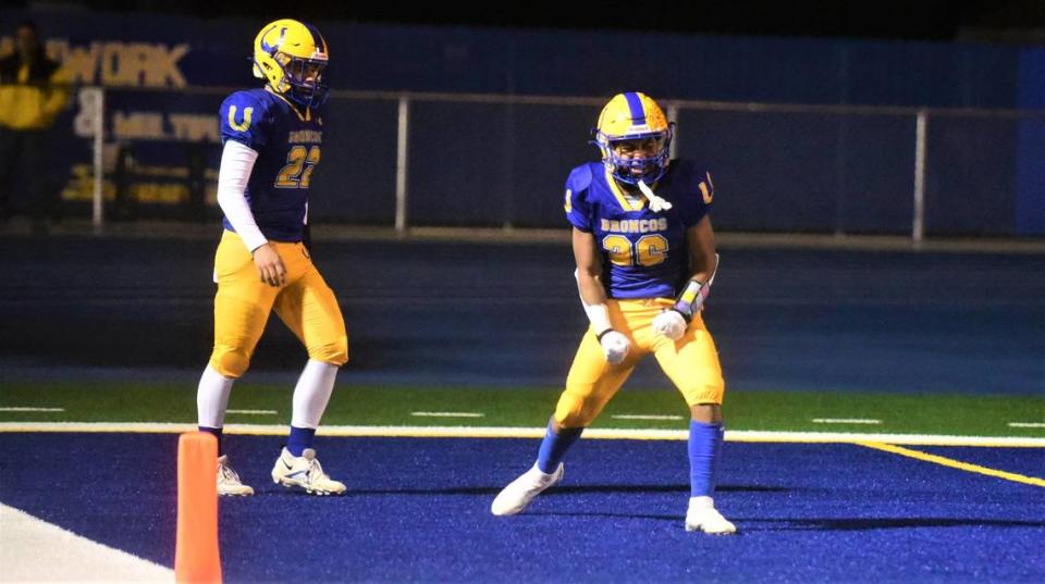 Dos Palos High School freshman running back Andre Flores (26) celebrates after scoring on a 44-yard touchdown run in a 28-27 playoff win over Morro Bay on Thursday, Nov. 19, 2022. Flores rushed for 253 yards and two touchdowns. Shawn Jansen/Sjansen@mercedsun-star.com