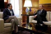 European Economic and Financial Affairs Commissioner Pierre Moscovici gestures during his meeting with Greek Prime Minister Alexis Tsipras at Maximos Mansion in Athens, Greece July 25, 2017. REUTERS/Alkis Konstantinidis