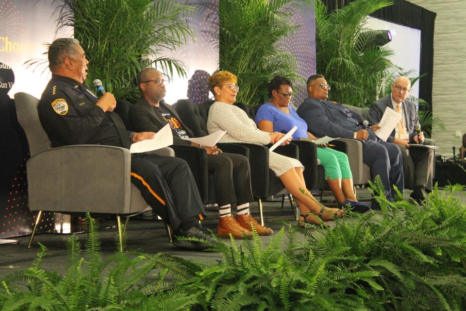 Panelists during a session of the "Choose Peace: Gun Violence Must Cease" summit  on Monday were, from left, Gainesville Police Department Chief Lonnie Scott; Zeriah Folston, director of the Office of Diversity, Equity, and Inclusion for the city of Gainesville; Gainesville City Commissioner Cynthia Chestnut; Melvena Wilson, director of the Center for Advocacy and Research on Health Equity); Pastor Karl Anderson of Upper Room Ministries and Gainesville Mayor Harvey Ward, who served as moderator of the panel.