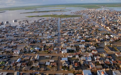 The streets were flooded in the northern Iranian village of Agh Ghaleh - Credit: ALI DEHGHAN/AFP/Getty Images