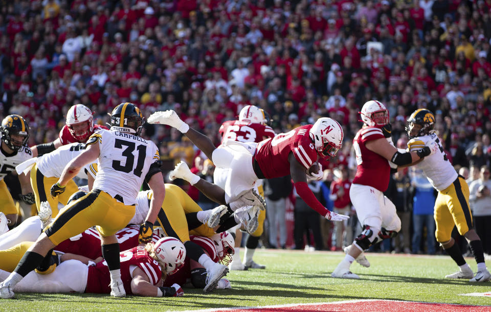 Nebraska running back Jaquez Yant (0) leaps into the end zone to score a touchdown against Iowa during the first half of an NCAA college football game Friday, Nov. 26, 2021, at Memorial Stadium in Lincoln, Neb. (AP Photo/Rebecca S. Gratz)