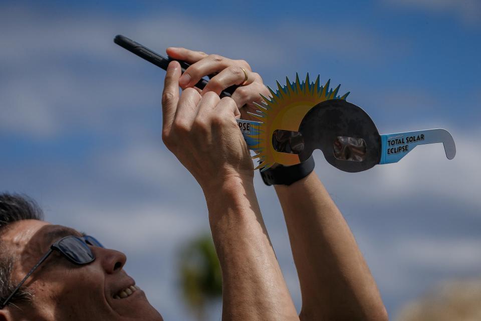 Ocean engineering professor Dr. P. Edgar An, Boca Raton, makes images during a solar eclipse viewing event at Florida Atlantic University on April 8, 2024, in Boca Raton, Fla.