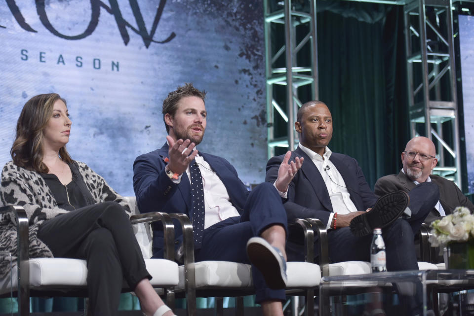 Beth Schwartz, from left, Stephen Amell, David Ramsey and Marc Guggenheim participate in The CW "Arrow: Final Season" panel during the Summer 2019 Television Critics Association Press Tour at the Beverly Hilton Hotel on Sunday, Aug. 4, 2019, in Beverly Hills, Calif. (Photo by Richard Shotwell/Invision/AP)