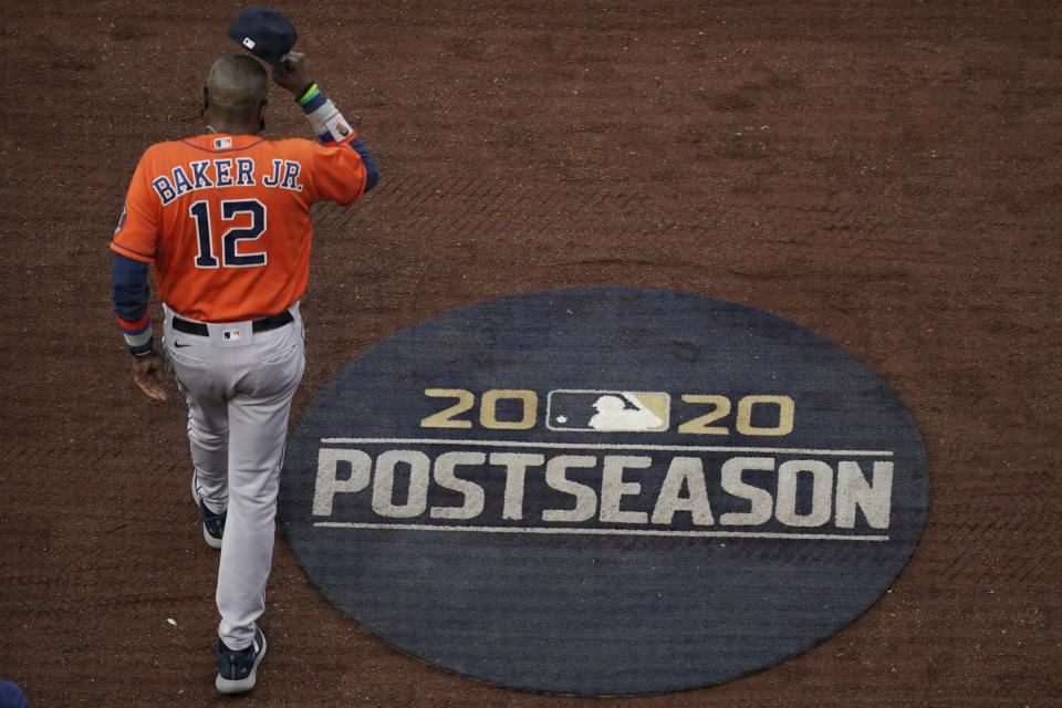 Houston Astros manager Dusty Baker Jr. walks out to the infield for the national anthem before Game 7 of a baseball American League Championship Series between the Houston Astros and the Tampa Bay Rays, Saturday, Oct. 17, 2020, in San Diego. (AP Photo/Gregory Bull)