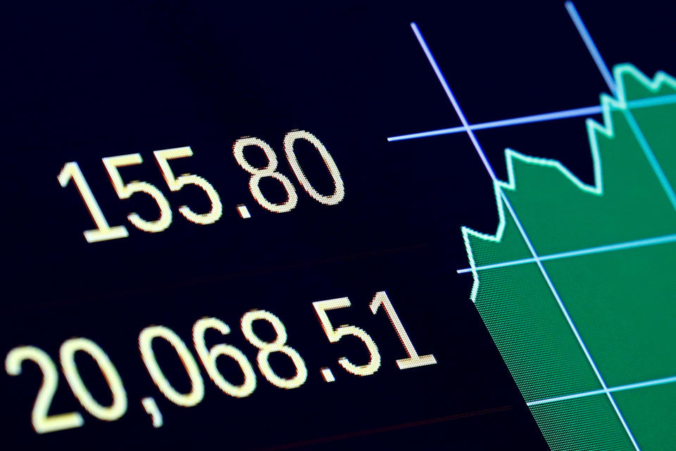 A screen displays the Dow Jones Industrial Average over the 20,000 mark following the closing bell on the floor of the New York Stock Exchange (NYSE) in New York, U.S., January 25, 2017. REUTERS/Brendan McDermid