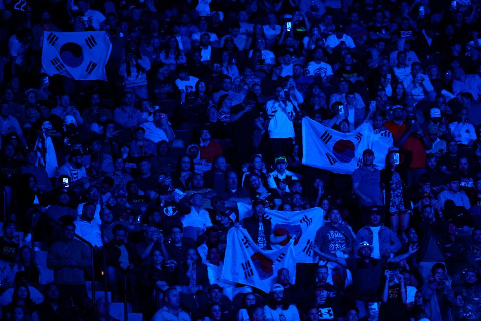 Fans of Chan Sung Jung, aka The Korean Zombie, wave Korean flags before the fight against Alexander Volkanovski at UFC 273 in Jacksonville. The series returns to Jacksonville on June 24.