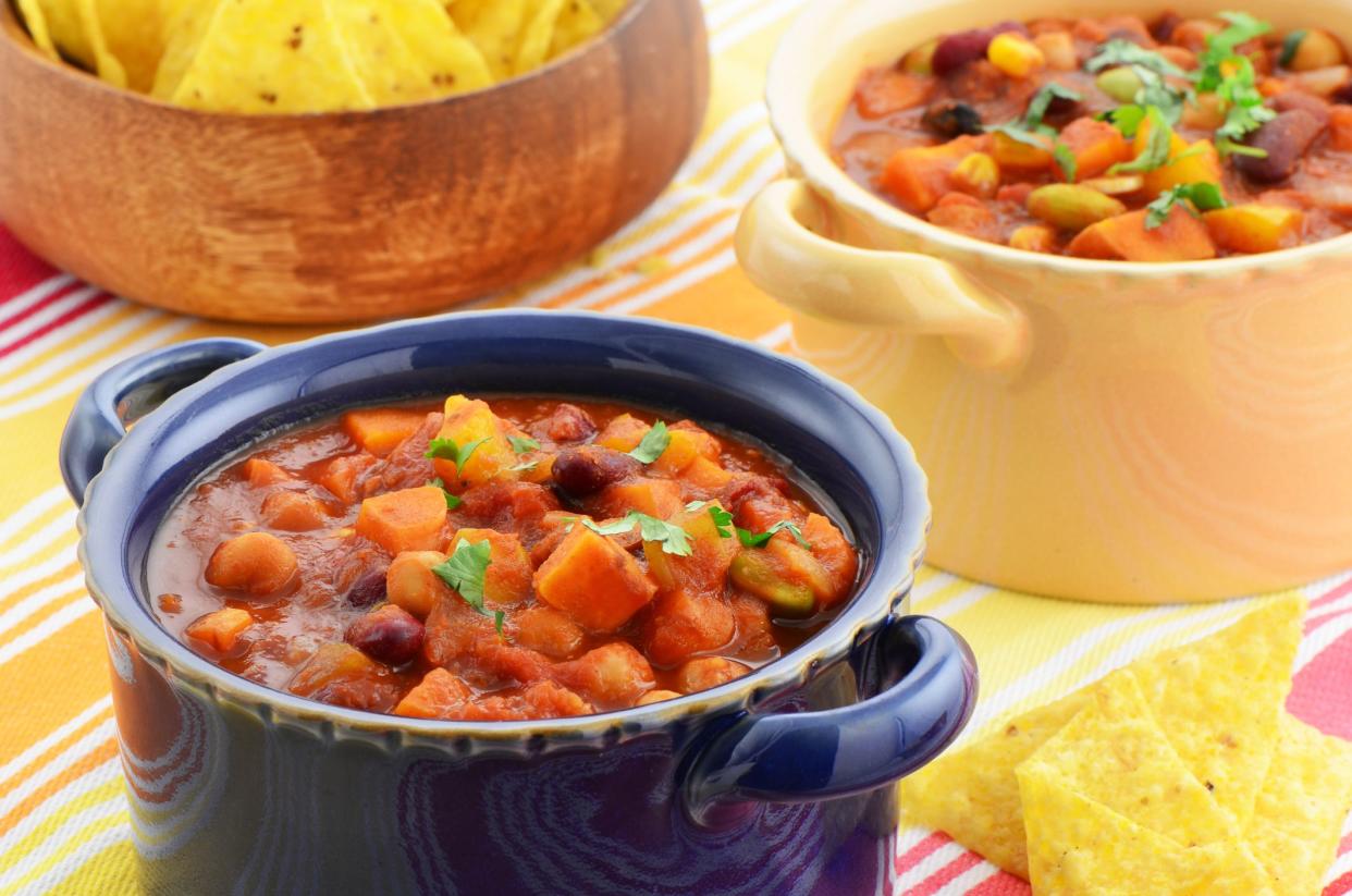 Nutritious vegetarian chili full of tomato, beans, peppers, sweet potato and corn