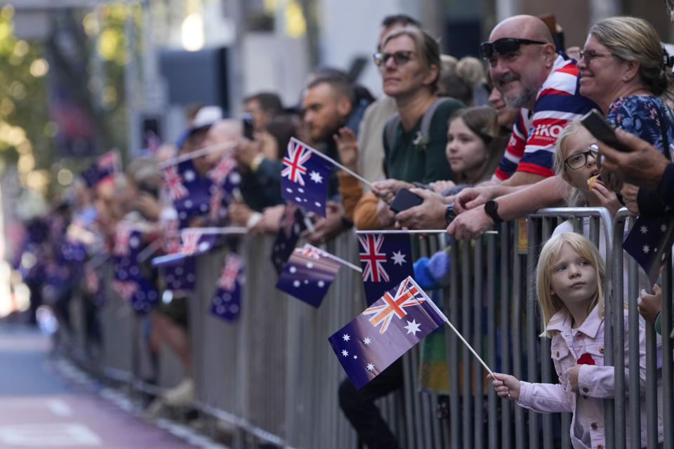 Crowds react as they watch the Anzac Day parade in the central business district of Sydney, Australia, Thursday, April 25, 2024. (AP Photo/Mark Baker)