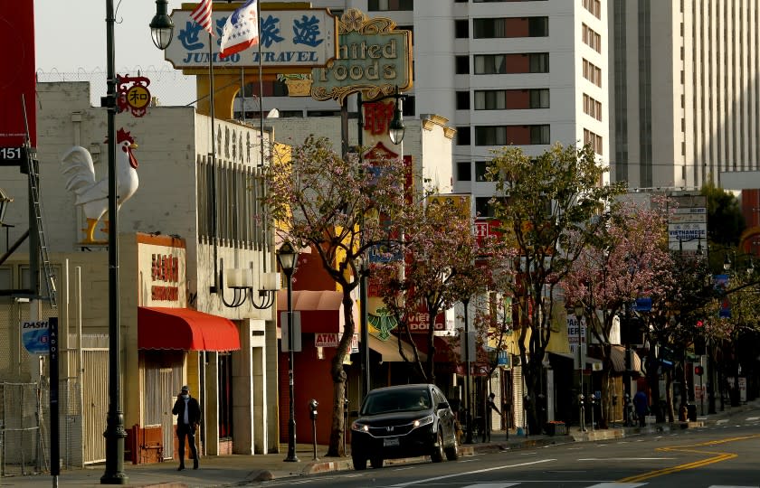 LOS ANGELES, CALIF. - APR. 4, 2020. Broadway through Chinatown is largely deserted due to the ongoing coronavirus lockdown that is affecting some 90 percent of the country. (Luis Sinco/Los Angeles Times)