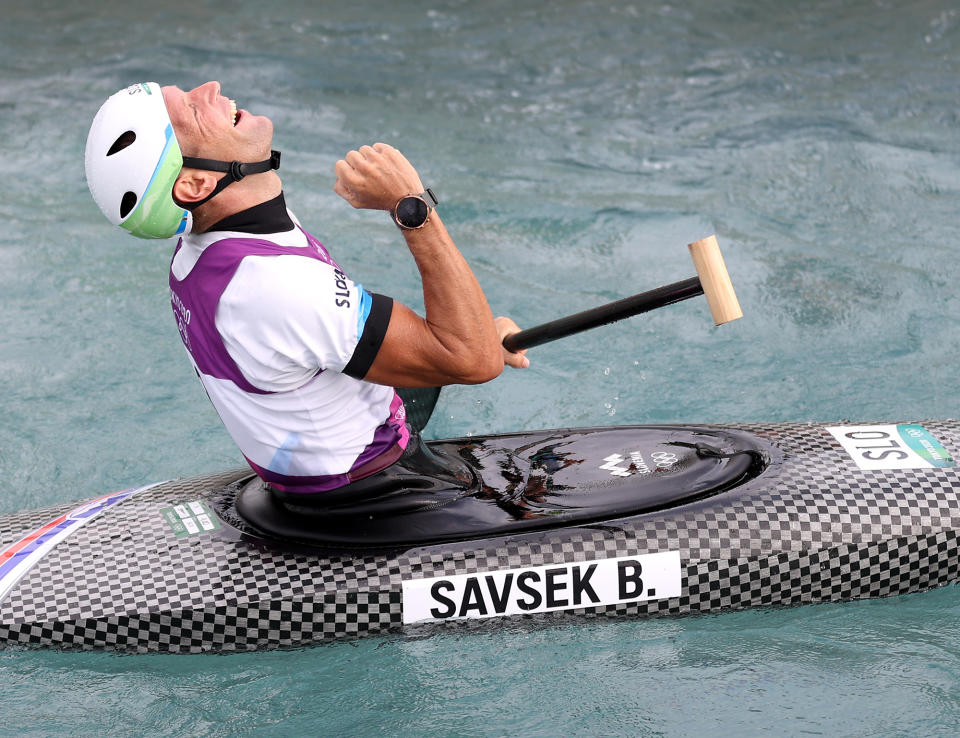 <p>Team Slovenia's Benjamin Savsek enjoys his gold medal run in the Men's Canoe Slalom Final at Kasai Canoe Slalom Centre on July 26.</p>