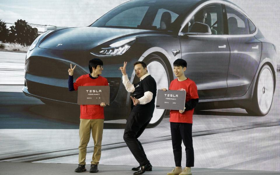 Elon Musk, chief executive officer of Tesla Inc., gestures during the Tesla China-Made Model 3 Delivery Ceremony at the company's Gigafactory in Shanghai, China