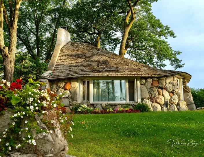 Photograph of a famous mushroom house by Rebecca Rhea of the Charlevoix Photography Club.