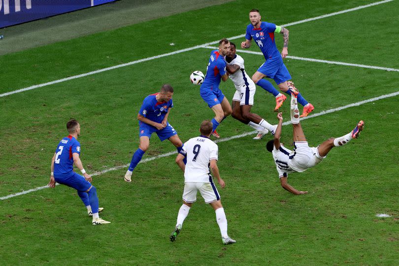 Jude Bellingham of England scores his team's first goal during the UEFA EURO 2024 round of 16 match between England and Slovakia at Arena AufSchalke