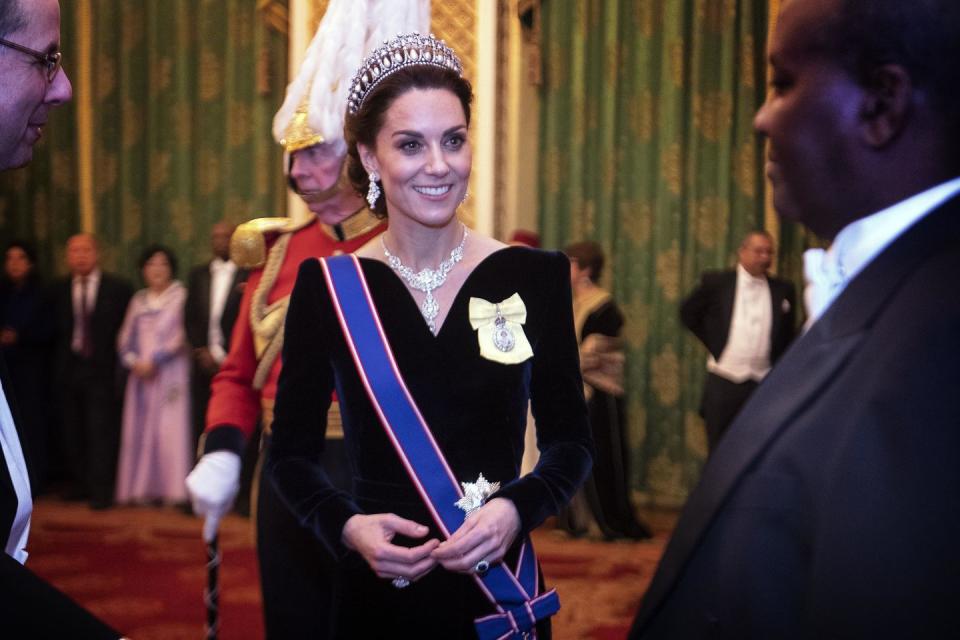 l0ndon, england   december 11 catherine, duchess of cambridge talks to guests at an evening reception for members of the diplomatic corps at buckingham palace on december 11, 2019 in london, englandphoto by victoria jones   wpa poolgetty images