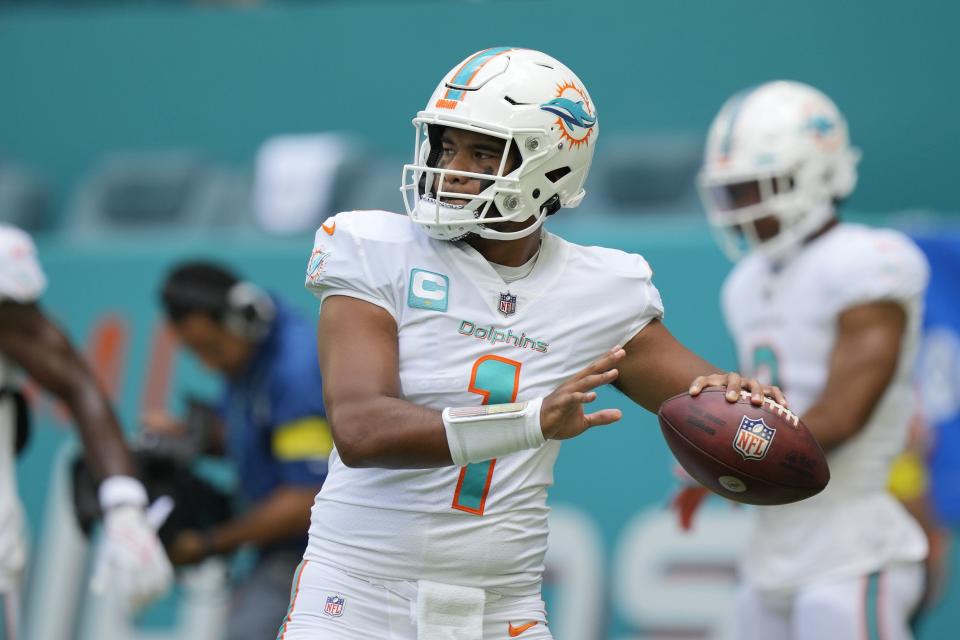 Miami Dolphins quarterback Tua Tagovailoa (1) warms up before an NFL football game against the New England Patriots, Sunday, Sept. 11, 2022, in Miami Gardens, Fla. (AP Photo/Rebecca Blackwell)