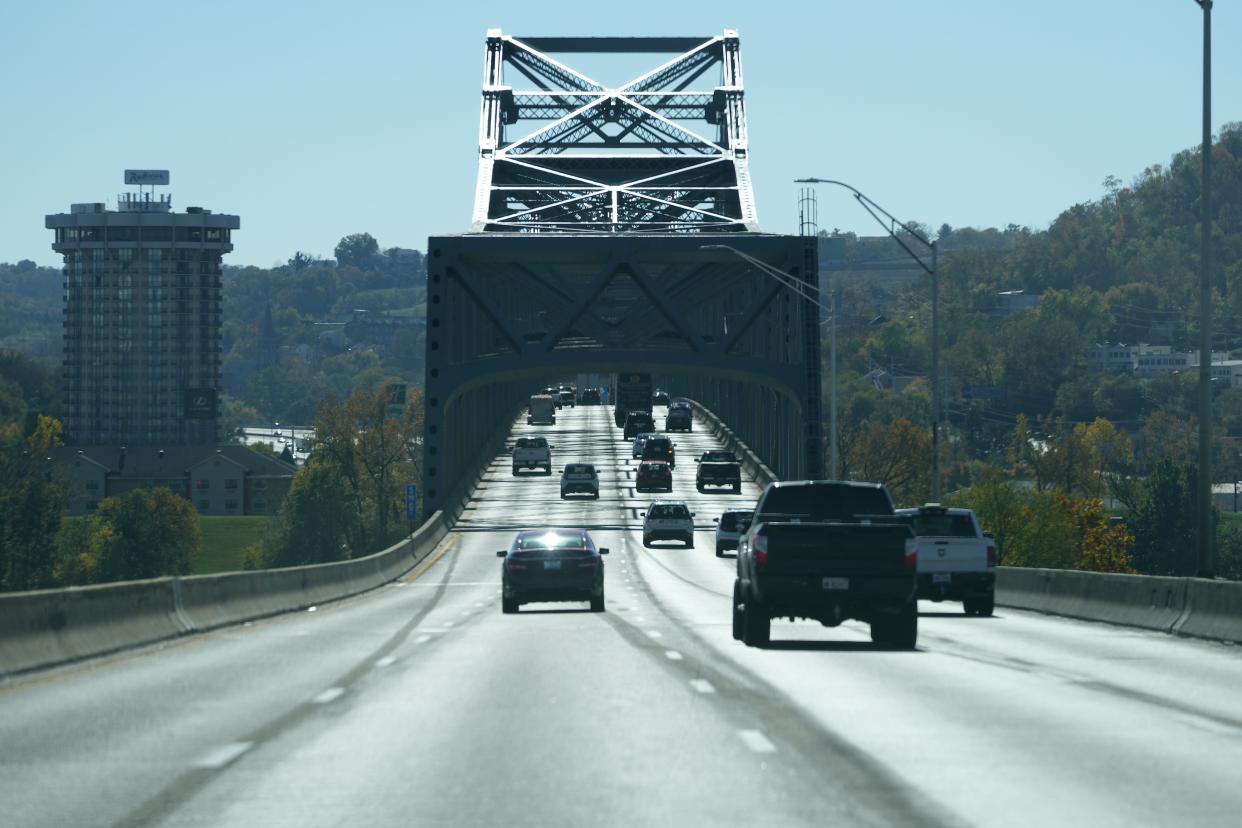 View of southbound traffic along the Brent Spence Bridge, pictured, Monday, Nov. 8, 2021. Two northbound lanes had been closed for eight months while crews painted and cleaned the bridge, which carries Interstate 75 traffic over the Ohio River between Ohio and Kentucky. The project included installing new overhead signs and "pavement tattoos."