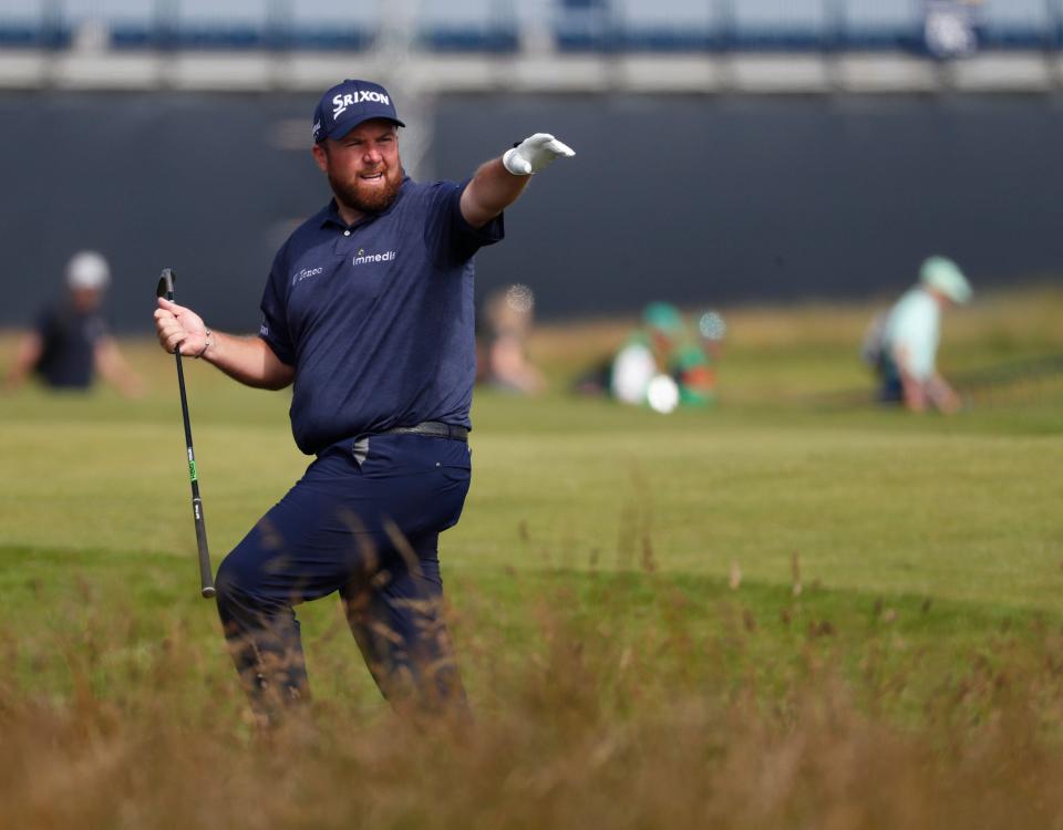 Shane Lowry gestures after playing out of the rough (AP)