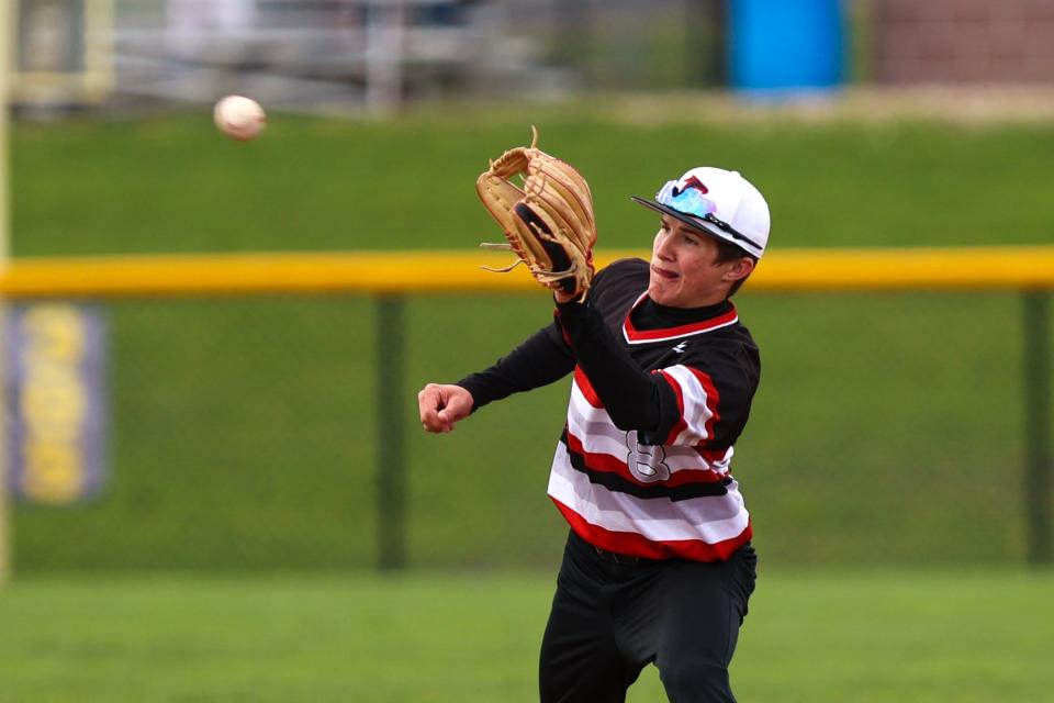 Field second baseman Logan Lonzrick makes a catch at the base during Tuesday night’s game at Streetsboro High School.