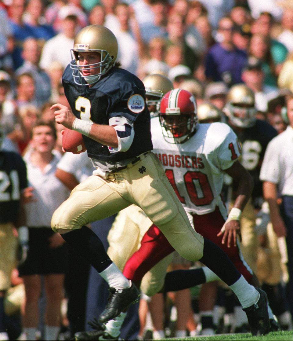 Notre Dame’s Rick Mirer breaks a big run against Indiana in 1991. Mirer started three seasons for the Irish and believes current quarterback Ian Book’s experience as a two-year starter will do him well this season.