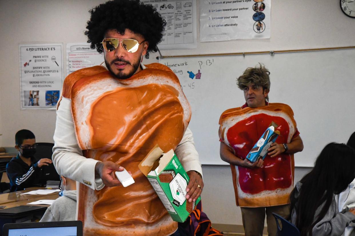 Jose Juan Urquizo and Ivan Rodriguez dress up as peanut butter and jelly toast while delivering ice cream sandwiches to students at Martin Luther King Jr. Academy in Salinas, Calif.