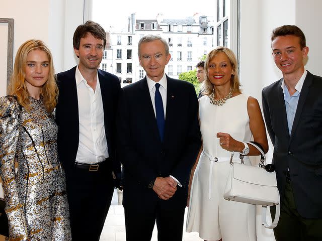 <p>Bertrand Rindoff Petroff/Getty</p> Bernard Arnault, Helene Mercier, Antoine Arnault, Natalia Vodianova, and Frederic Arnault attend the Berluti Menswear Spring/Summer 2016 show as part of Paris Fashion Week on June 26, 2015.